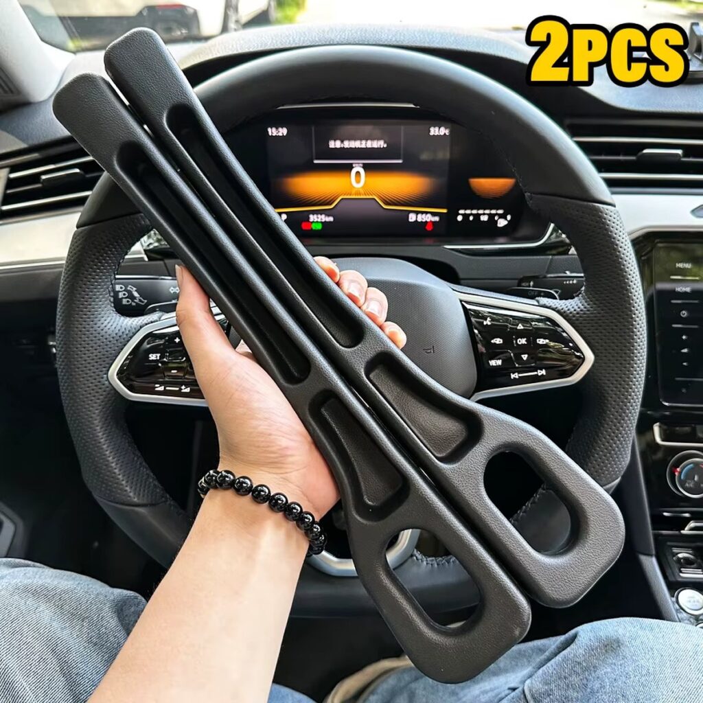 A pair of black seat gap fillers held in a car