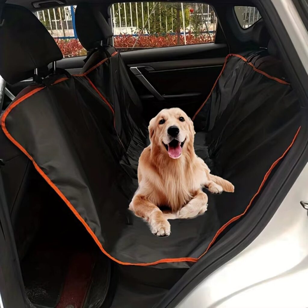 Dog lying on a black back seat cover