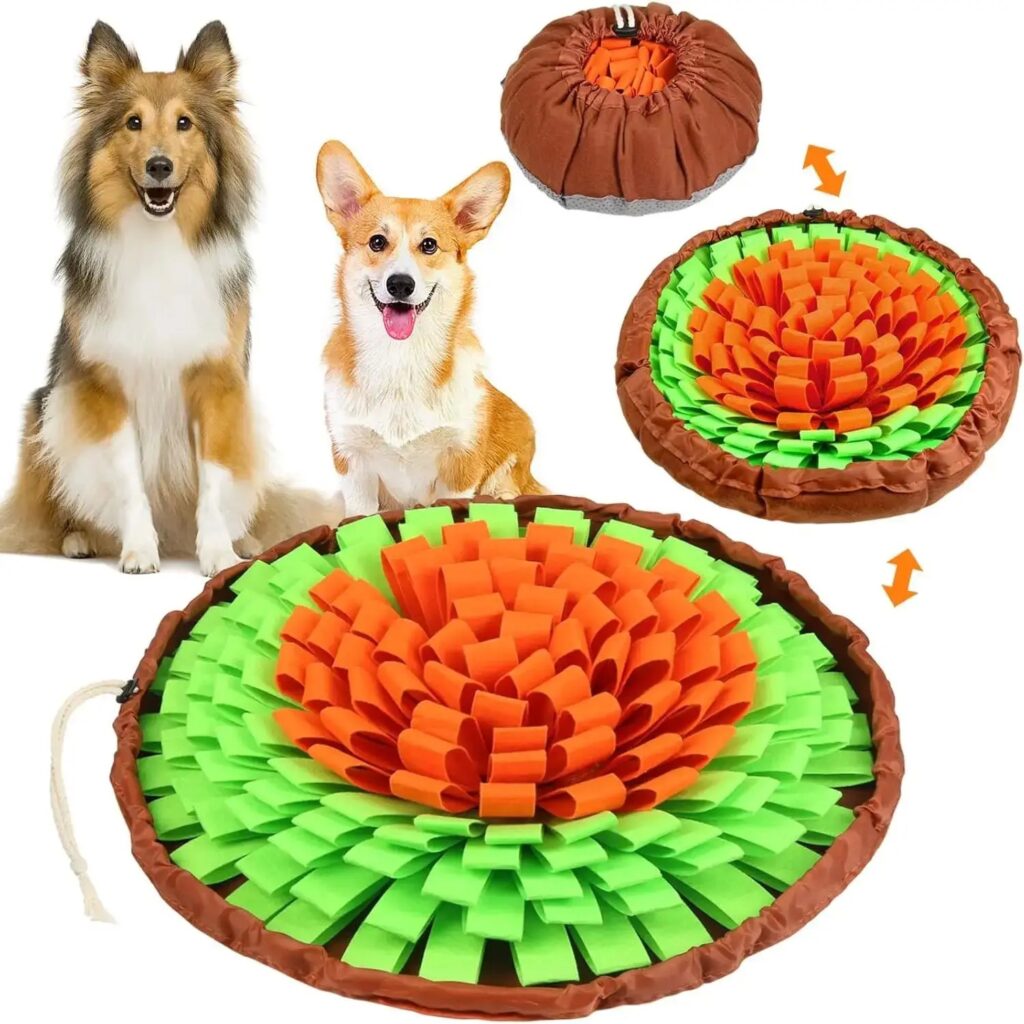 Orange and green flower snuffle mat laid flat, with two dogs